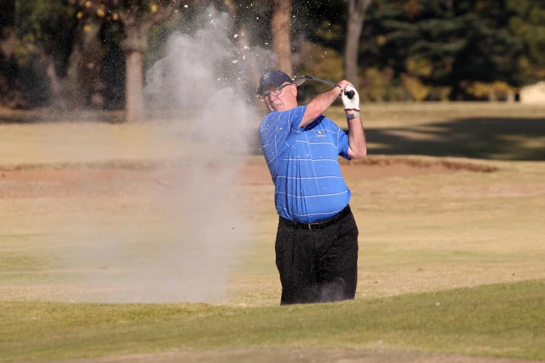 a man hitting a golf ball out of a sand trap, a portrait, flickr, blowing out smoke, 15081959 21121991 01012000 4k, college, profile pic