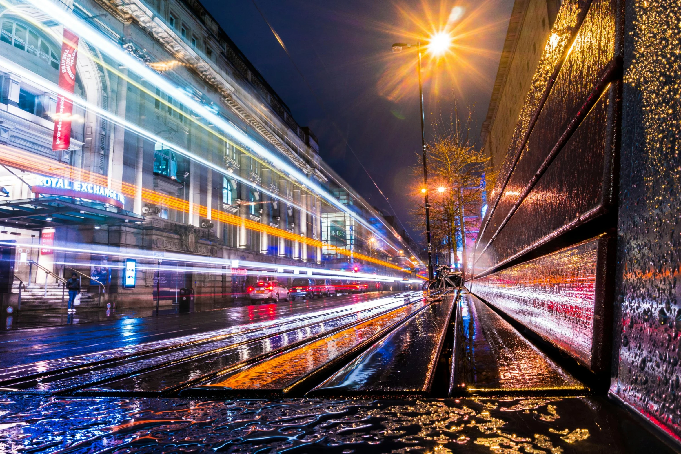 a city street filled with lots of traffic at night, by Adam Marczyński, unsplash contest winner, graffiti, on a wet london street, tram, glasgow, light speed