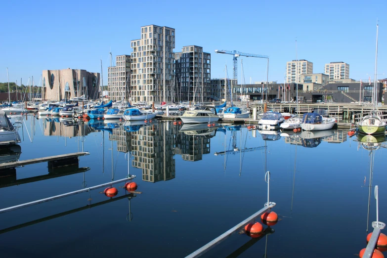 a harbor filled with lots of boats next to tall buildings, by Washington Allston, pexels contest winner, modernism, reykjavik junior college, reflective windows, utrecht, thumbnail