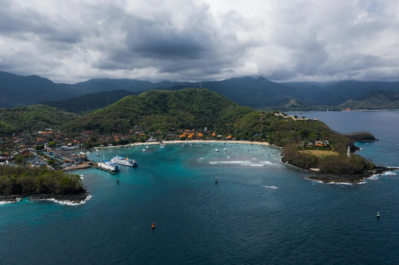 a small island in the middle of a body of water, by Daren Bader, pexels contest winner, sumatraism, harbor, stormy snowy fiji mountain, thumbnail, wide aerial shot