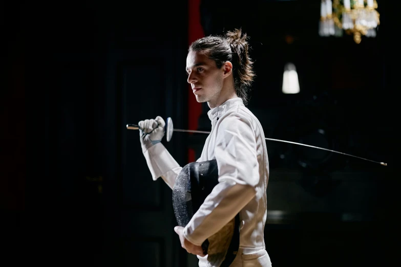 a woman in a fencing stance holding a sword, a portrait, unsplash, arabesque, a handsome, production photo, plating, max dennison