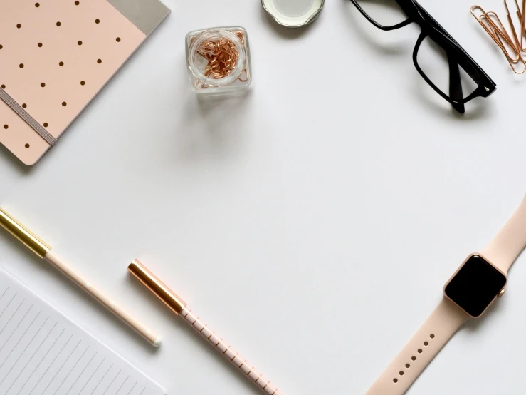 an apple watch sitting on top of a desk next to a cup of coffee, trending on pexels, minimalism, square rimmed glasses, pencil and paper, light pink background, background image