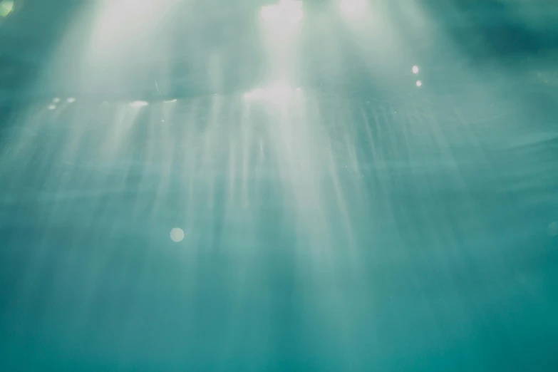 the sun shines brightly through the water, an album cover, inspired by Elsa Bleda, unsplash, light and space, underwater westminster, lights beam, cyan mist, photograph taken in 2 0 2 0