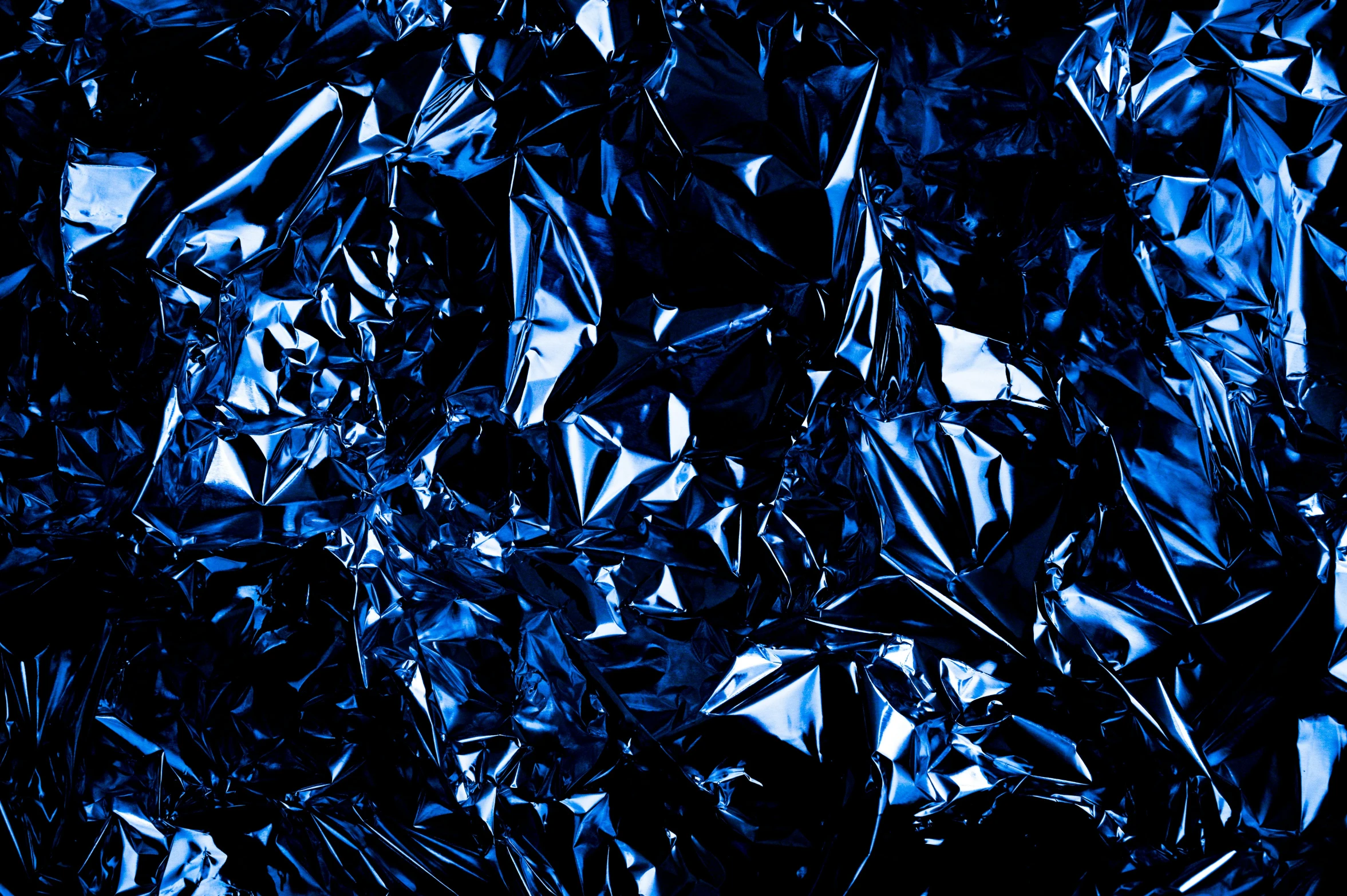 a close up of foil on a black background, an album cover, by Julia Pishtar, pexels, plasticien, blue realistic 3 d render, sapphires, all dark blue metal, stainless steel