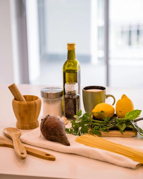 a table topped with lots of different types of food, a still life, by Alice Mason, unsplash, made of spaghetti, olive oil, miniature product photo, grey