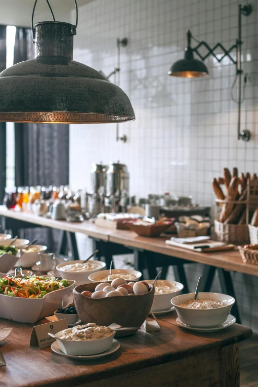 a wooden table topped with bowls of food, unsplash, breakfast buffet, clean lighting, tall, sparkling