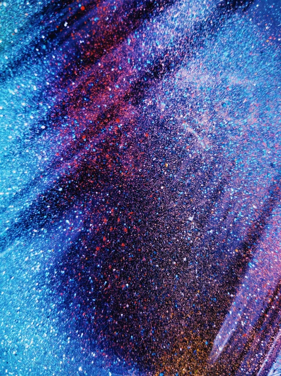 a close up of a cell phone with a blurry background, a microscopic photo, by Julia Pishtar, holography, purple and blue leather, glitter gif, starry sky 8 k, high angle close up shot
