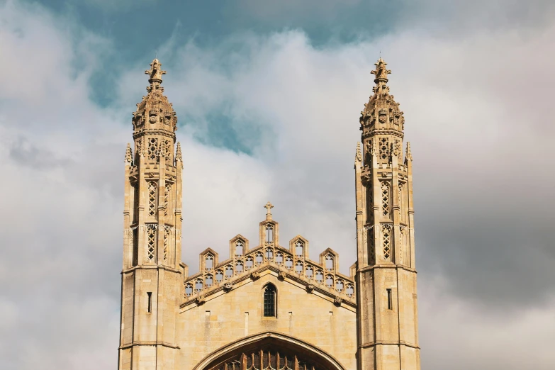 a couple of people that are standing in front of a building, an album cover, by Rachel Reckitt, unsplash contest winner, baroque, two organic looking towers, warwick saint, seen from outside, college