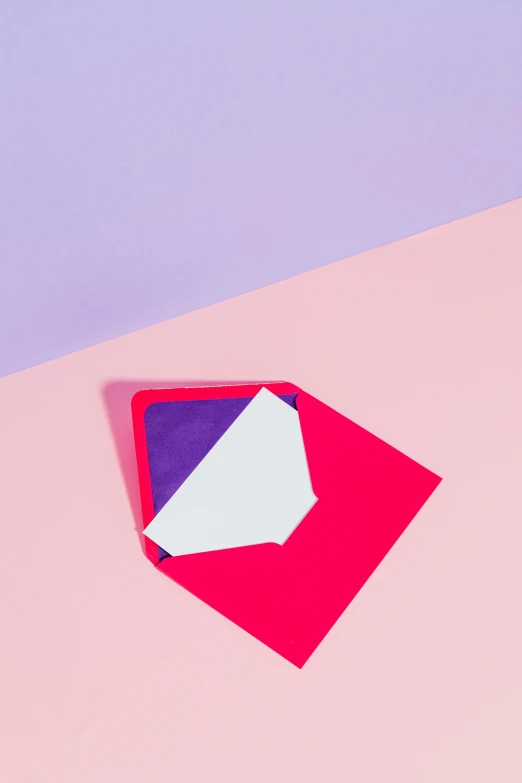 a piece of paper sitting on top of a pink and blue surface, by Julia Pishtar, trending on unsplash, color field, red and purple, email, neon geometry, angular minimalism