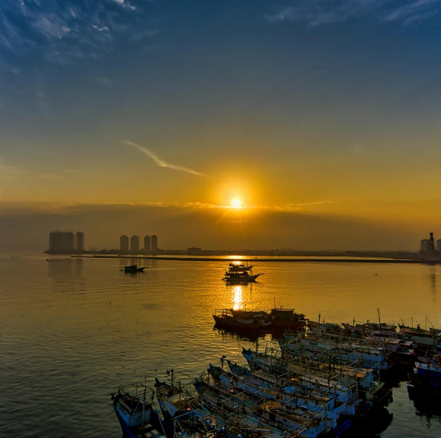 a group of boats sitting on top of a body of water, by Ibrahim Kodra, pexels contest winner, morning sun, port city, hou china, slide show