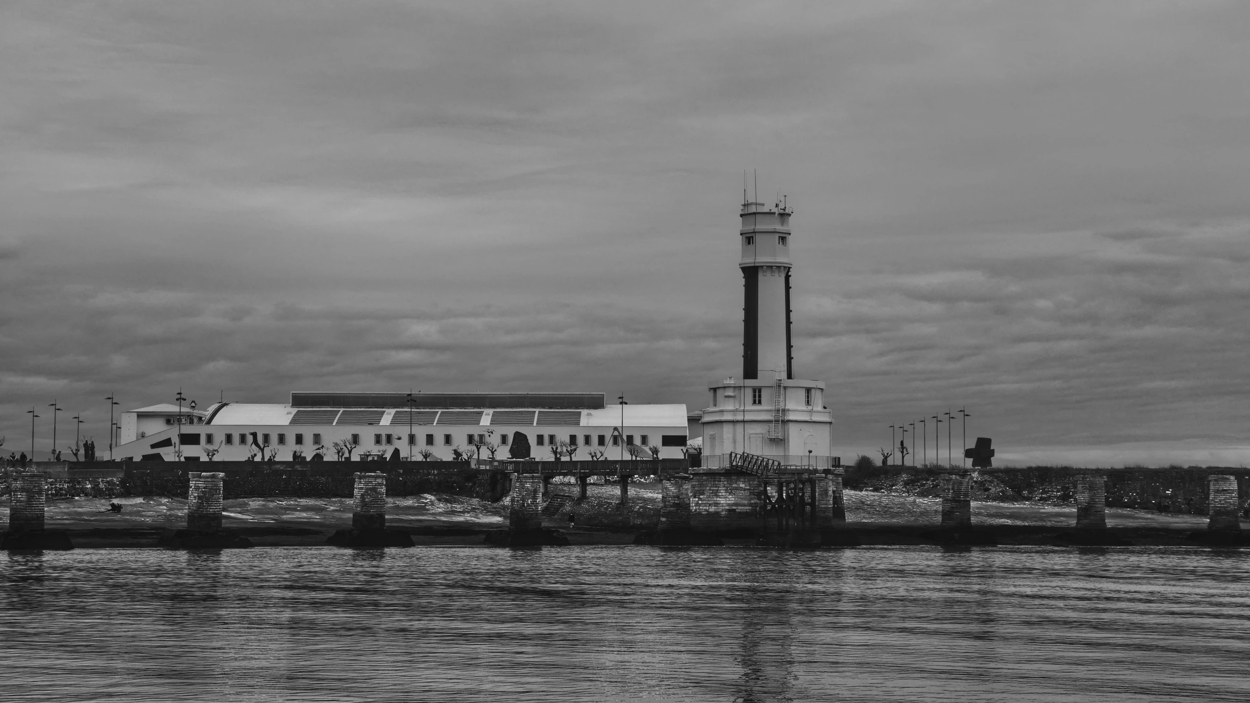 a black and white photo of a lighthouse, by Felipe Seade, pexels contest winner, art nouveau, manila, terminals, vallejo, from side