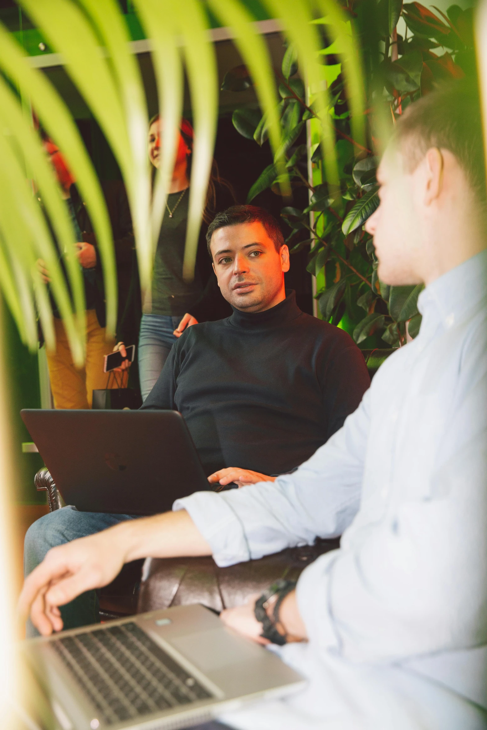 two men sitting on a couch with laptops, unsplash, lush surroundings, in meeting together, a blond, talking