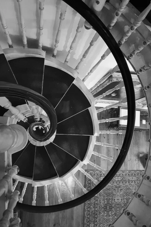 a black and white photo of a spiral staircase, inspired by M.C. Escher, unsplash contest winner, baroque, white mechanical details, in a castle, taken on go pro hero8, fotografia blanco y negro