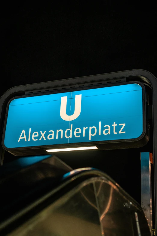 a close up of a street sign near an escalator, by Alexander Brook, happening, ue marketplace, albert bierdstat, on black background, under blue