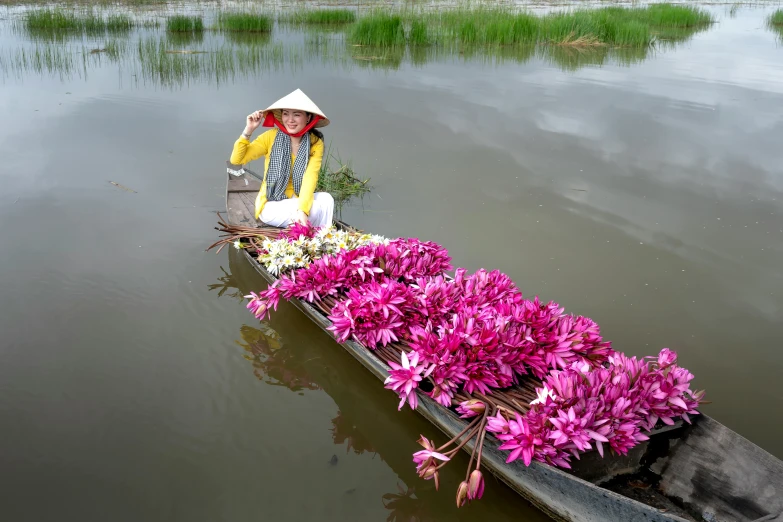 a person in a boat filled with flowers, bao phan, slide show, multiple stories, high resolution photo