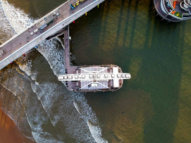 a large boat traveling down a river next to a bridge, by Matthias Stom, pexels contest winner, hurufiyya, flat lay, david a trampier, hull is a opera house, full frame image