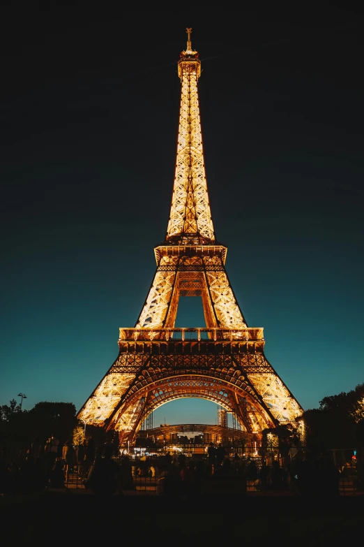 the eiffel tower lit up at night, pexels contest winner, plain background, stunningly detailed, low quality photo, mid shot photo
