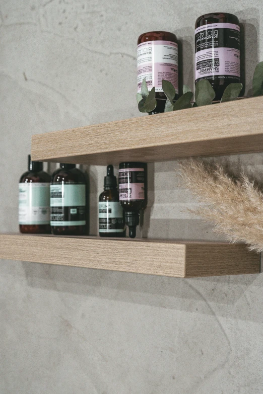 a shelf that has some bottles on it, a picture, unsplash, premium bathroom design, textured base ; product photos, oak, ultra textured