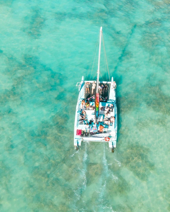 a group of people riding on top of a boat in the ocean, flatlay, aruba, profile image, multiple stories