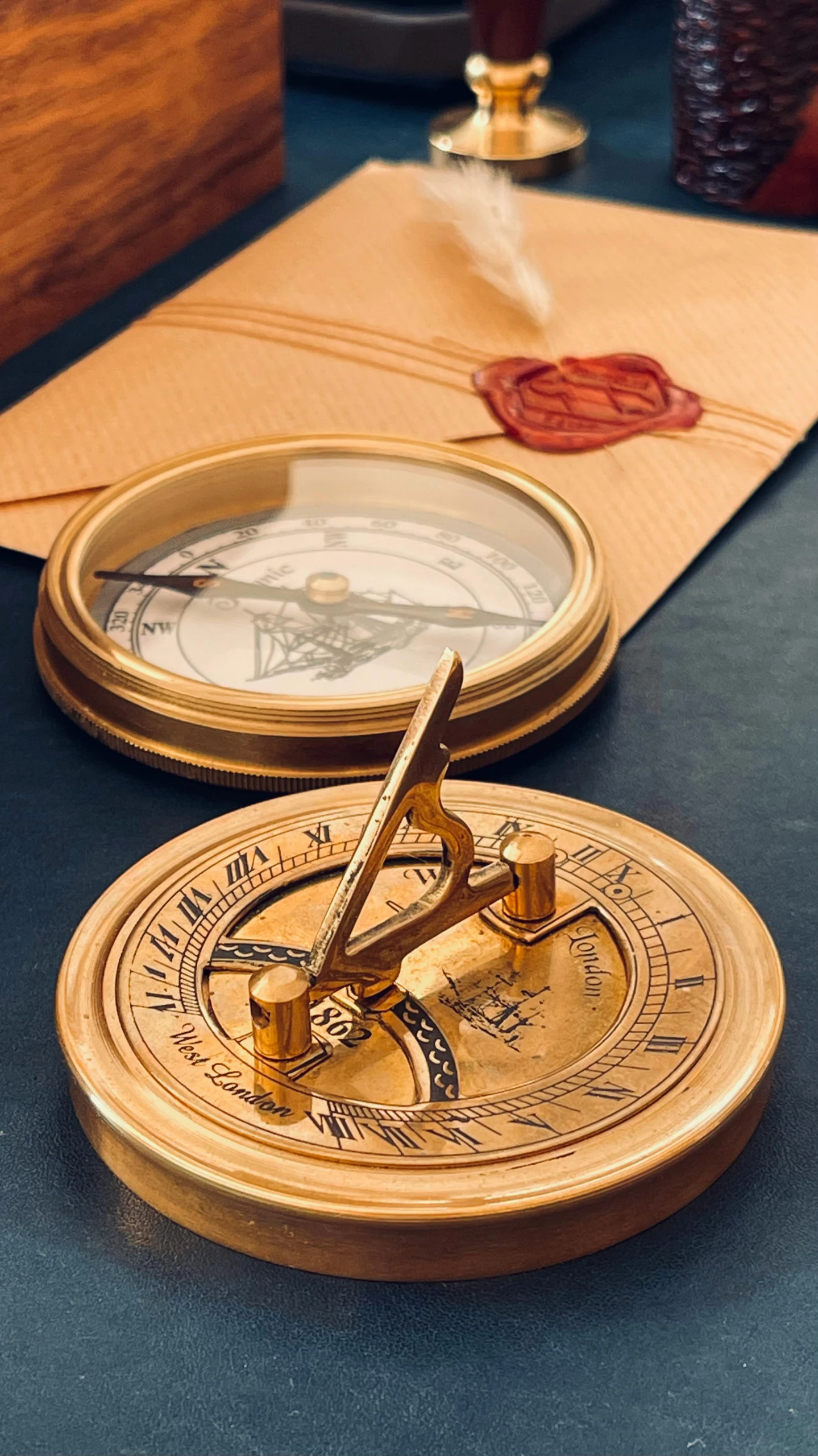 a close up of a compass on a table, an album cover, inspired by Leonardo da Vinci, trending on pexels, arts and crafts movement, brass plates, mini model, sundial, thumbnail