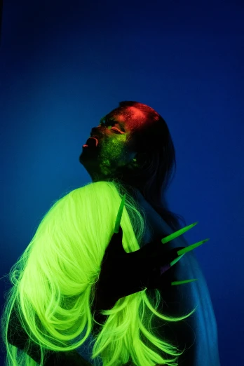 a man with neon hair holding a pair of scissors, an album cover, inspired by Elsa Bleda, zendaya as she-hulk, nick knight, slide show, spooky photo