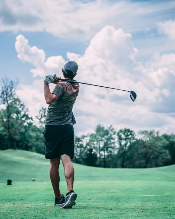 a man swinging a golf club at a golf course, pexels contest winner, renaissance, lgbtq, thumbnail, 1 2 9 7