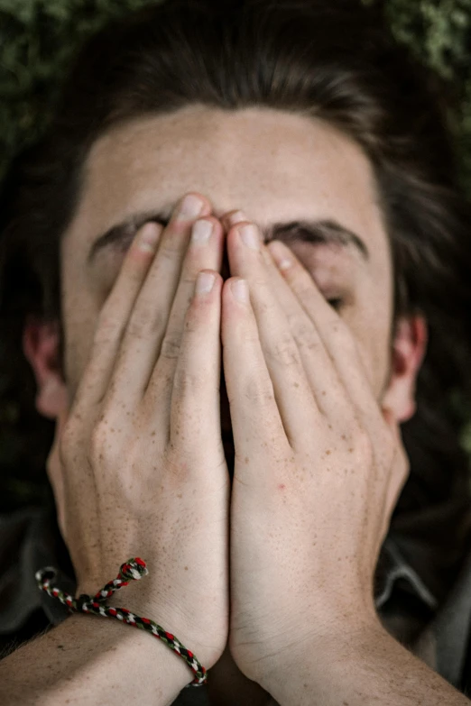 a man covering his face with his hands, pexels, movie still of a tired, jay bauman, submecanophobia, speak no evil