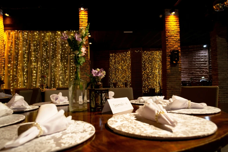 a wooden table topped with plates and silverware, glowing drapes, vip room, thumbnail, blanca alvarez