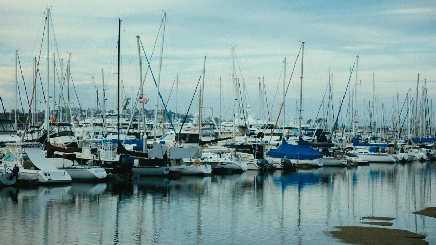 a bunch of boats that are sitting in the water, by Carey Morris, pexels contest winner, vhs colour photography, caulfield, harbor, ignant