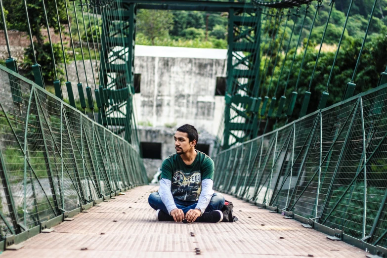 a woman sitting on the ground on a bridge, a portrait, by Niko Henrichon, pexels contest winner, beautiful man, avatar image, sayem reza, full body photo