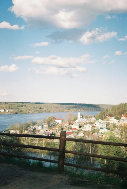 a view of a city from the top of a hill, a picture, inspired by Isaac Levitan, unsplash, romanticism, kodak portra 4 0 0, great river, tula, 1990s photograph