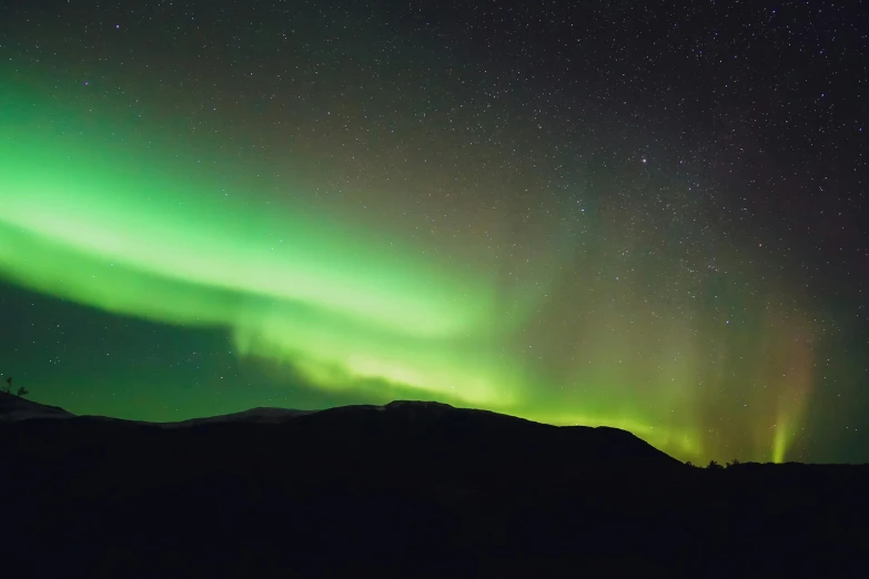 the aurora bore lights up the night sky, pexels contest winner, hurufiyya, black and green, mood lighting, mount, multicoloured