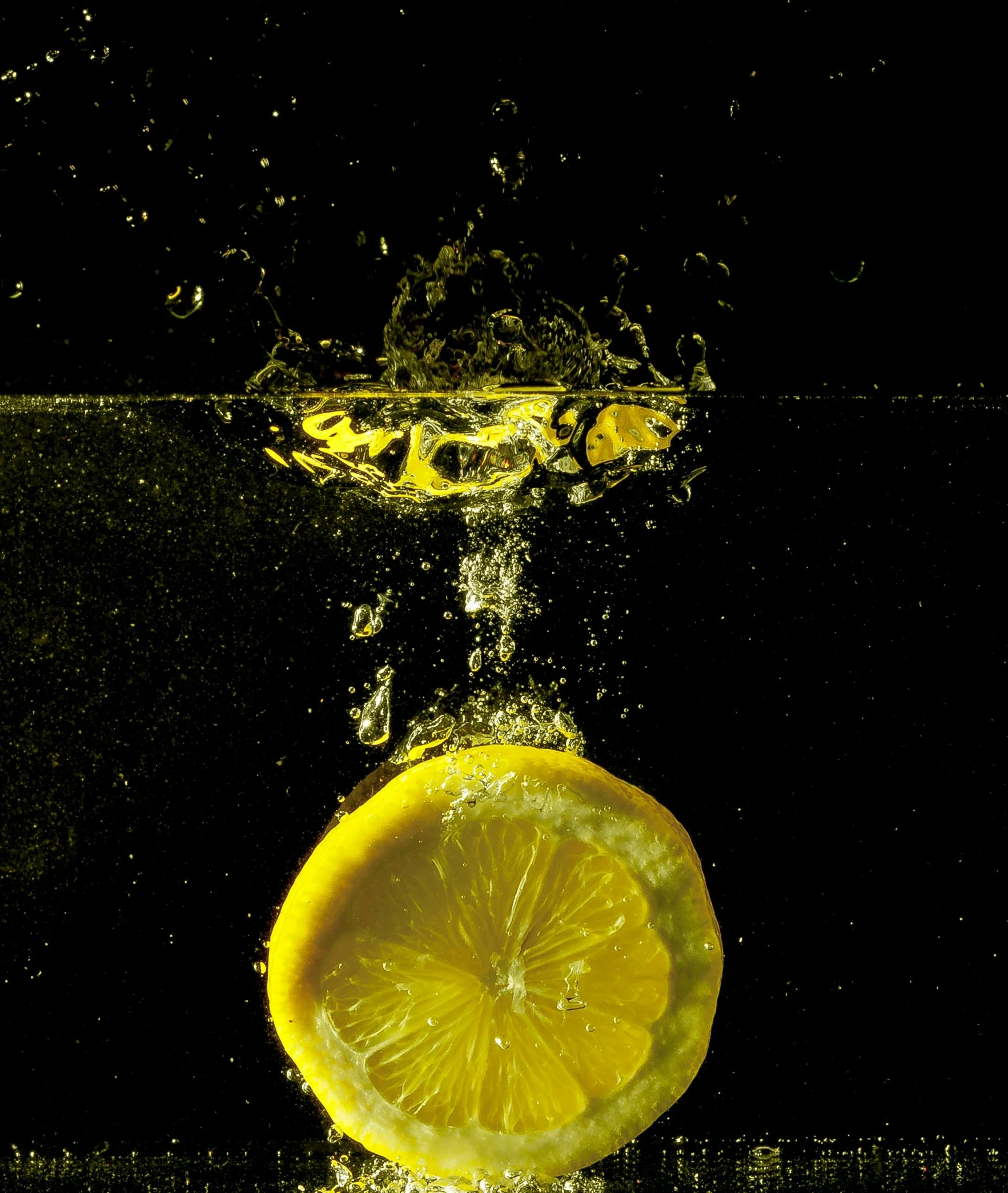 a slice of lemon being dropped into the water, an album cover, by Peter Churcher, pexels, paul barson, thumbnail, hydration, uv