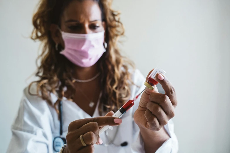 a woman in a lab coat holding a syet, a photo, trending on pexels, surgical iv drip, syringe, brown, essence