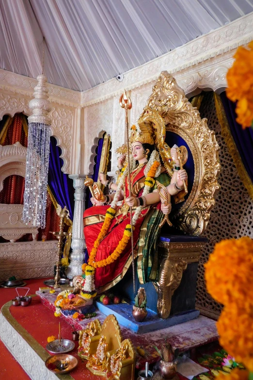 a statue of a woman sitting on a throne, a statue, samikshavad, ornate with fiery explosions, decorations, on location, multiple stories