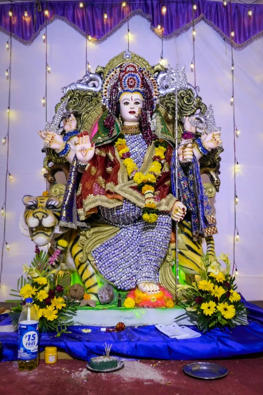 a statue of a woman sitting on top of a table, a statue, samikshavad, elaborate costume, avatar image, in 2 0 1 8, sacred tiger