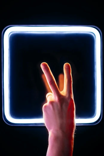 a person making a peace sign with their fingers, a hologram, inspired by David LaChapelle, pexels contest winner, light and space, light box, showing victory, slightly minimal, reboot