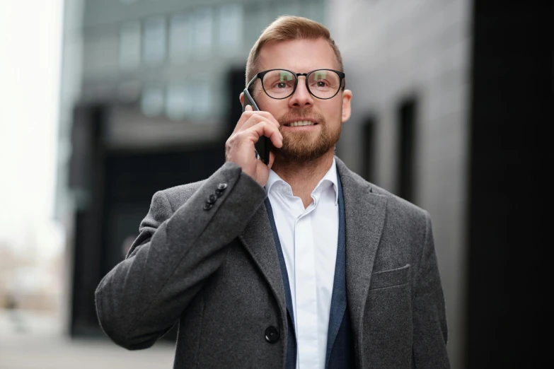 a man with glasses talking on a cell phone, by Andries Stock, pexels contest winner, hurufiyya, in suit with black glasses, hr ginger, hip corporate, фото девушка курит