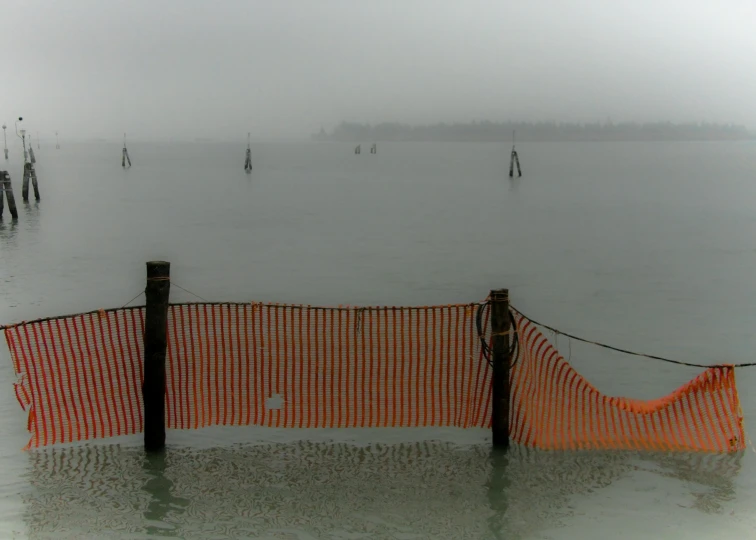 there is no image here to provide a caption for, a picture, by Christo, flickr, venice, barriers, bad weather approaching, grey orange