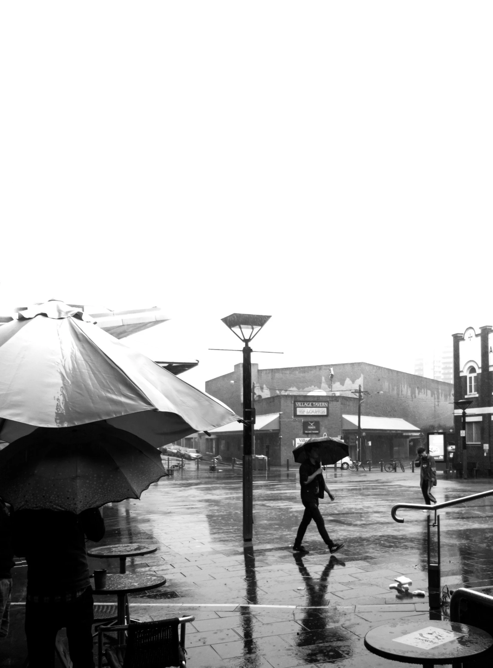 a black and white photo of people walking in the rain, panoramic shot, market, instagram picture, square