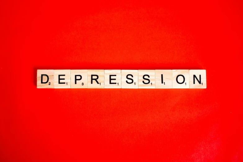 the word depression spelled in scrabbles on a red background, an album cover, by Meredith Dillman, pexels, expressionism, on a pale background, hypnosis, a wooden, television