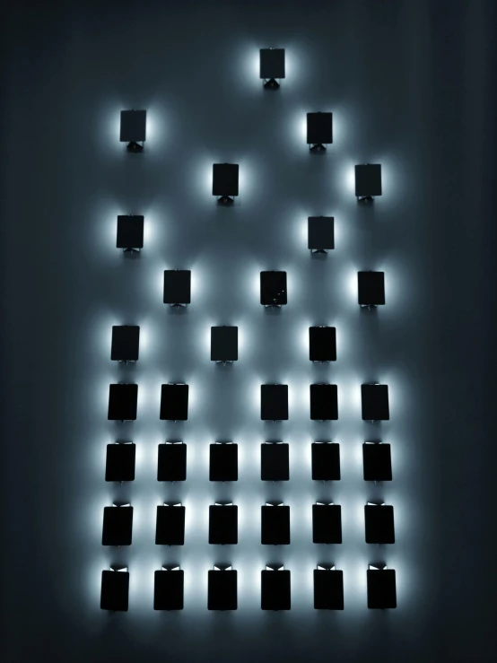 a wall that has some lights on it, by Alejandro Obregón, in style of robert mapplethorpe, army of robotic penguins, medium portrait top light, holy lights