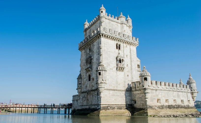 a tall tower sitting on top of a body of water, by Tom Wänerstrand, pexels contest winner, art nouveau, lisbon, limestone, 1 6 0 0 s, a wooden