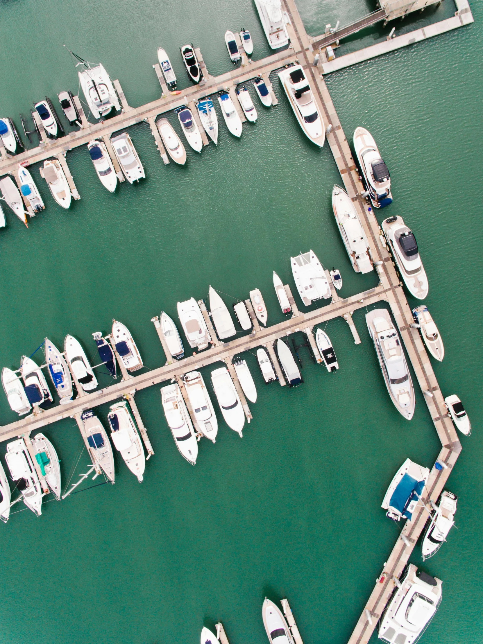 a marina filled with lots of white boats, pexels contest winner, top down view, 8k resolution”, chicago, cinematic”