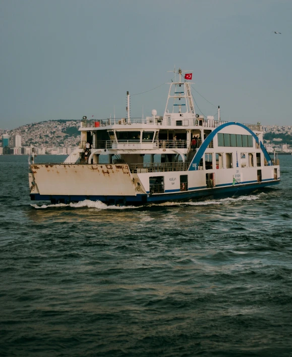a large boat traveling across a body of water, by Carey Morris, pexels contest winner, hurufiyya, istanbul, non-binary, high quality product image”, album cover