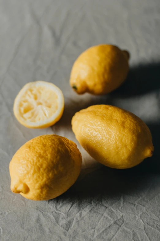 a group of lemons sitting on top of a table, detailed product image, subtle, thumbnail, f/1.4