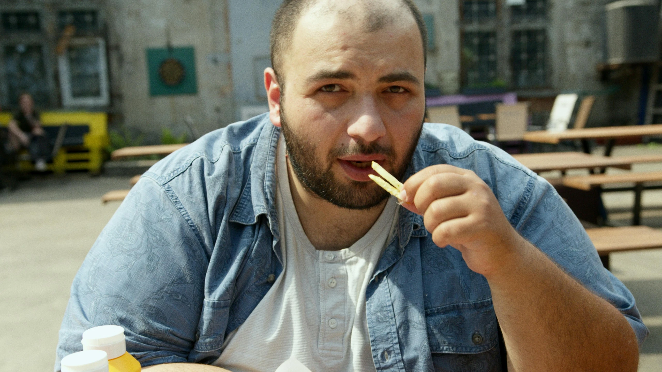 a man sitting at a table with chopsticks in his mouth, inspired by Nabil Kanso, pexels contest winner, les nabis, jontron, square, middle eastern, vadim voitekhovitch