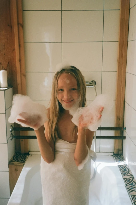 a woman standing in a bathtub holding cotton floss, by Sara Saftleven, pexels contest winner, panoramic view of girl, made of cotton candy, furry arms, sauna