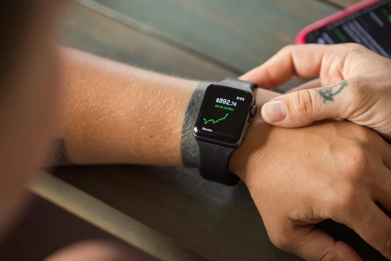 a close up of a person holding an apple watch, a photo, square, charts, tough, thumbnail