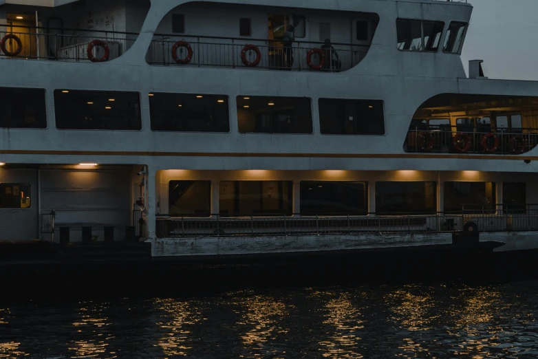 a large boat sitting on top of a body of water, by Niko Henrichon, pexels contest winner, modernism, side lights, exterior view, gif, regal aesthetic